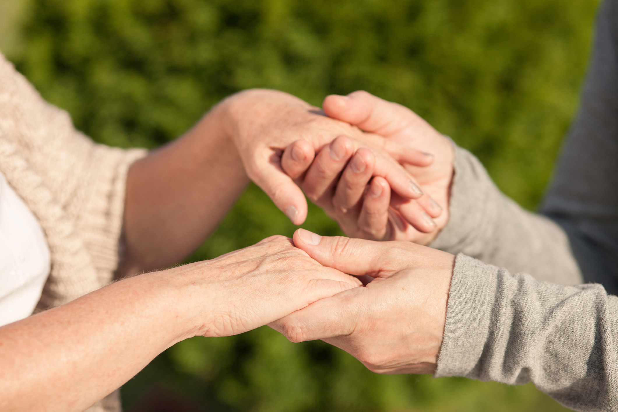 hands of senior and caregiver